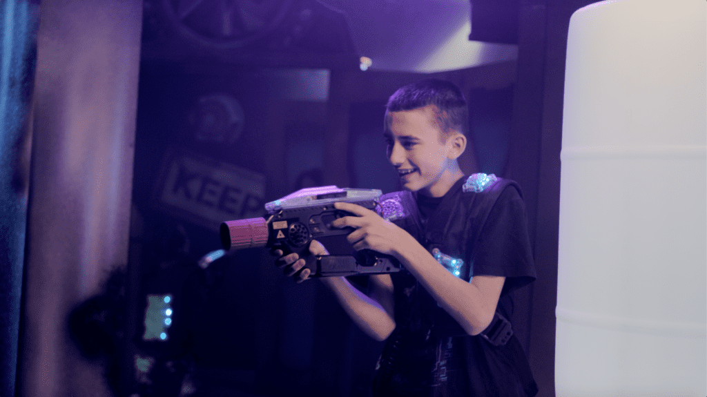 Child playing laser tag at Rev'd Up Fun