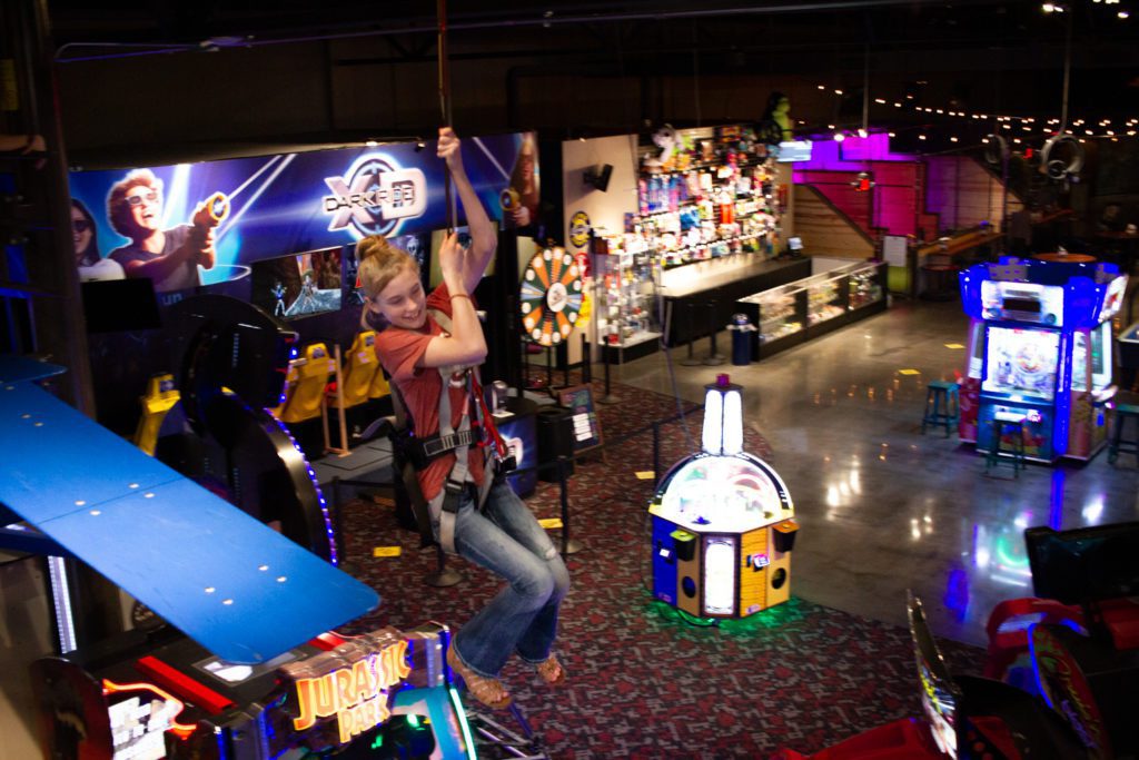 Child on the zip line at the family entertainment center