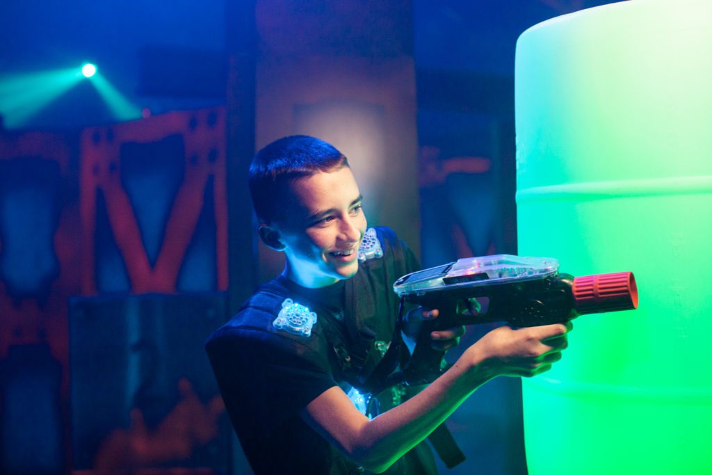 Child playing laser tag