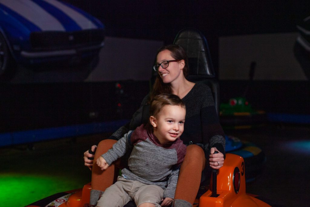 Mother and son drive a bumper car