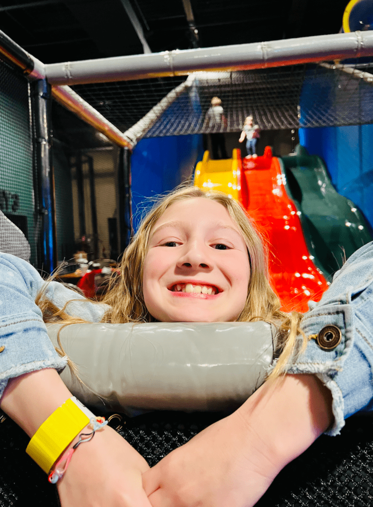 Child enjoying the indoor activities at Rev'd Up Fun